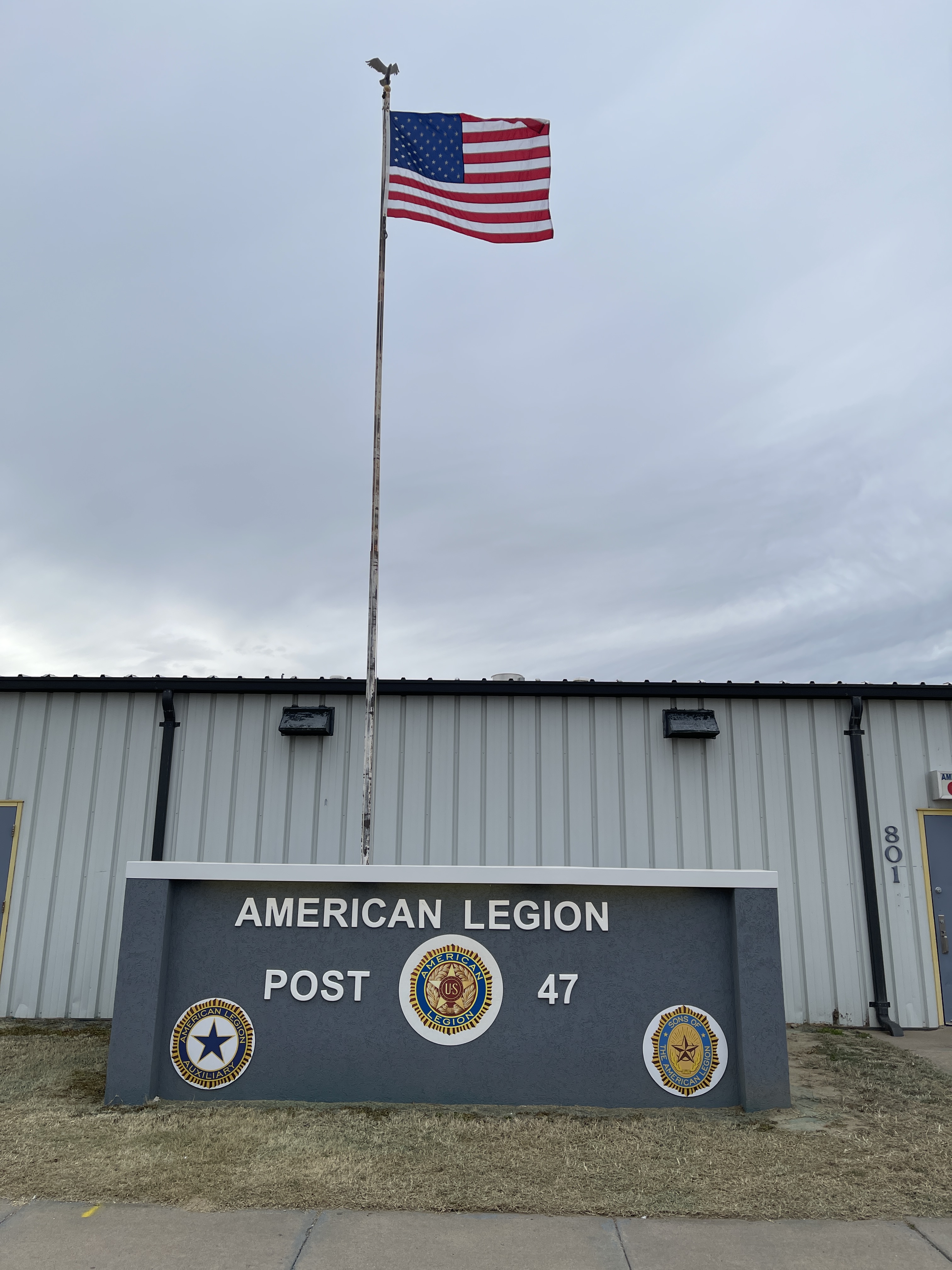 American Legion Post 47 monument and flag